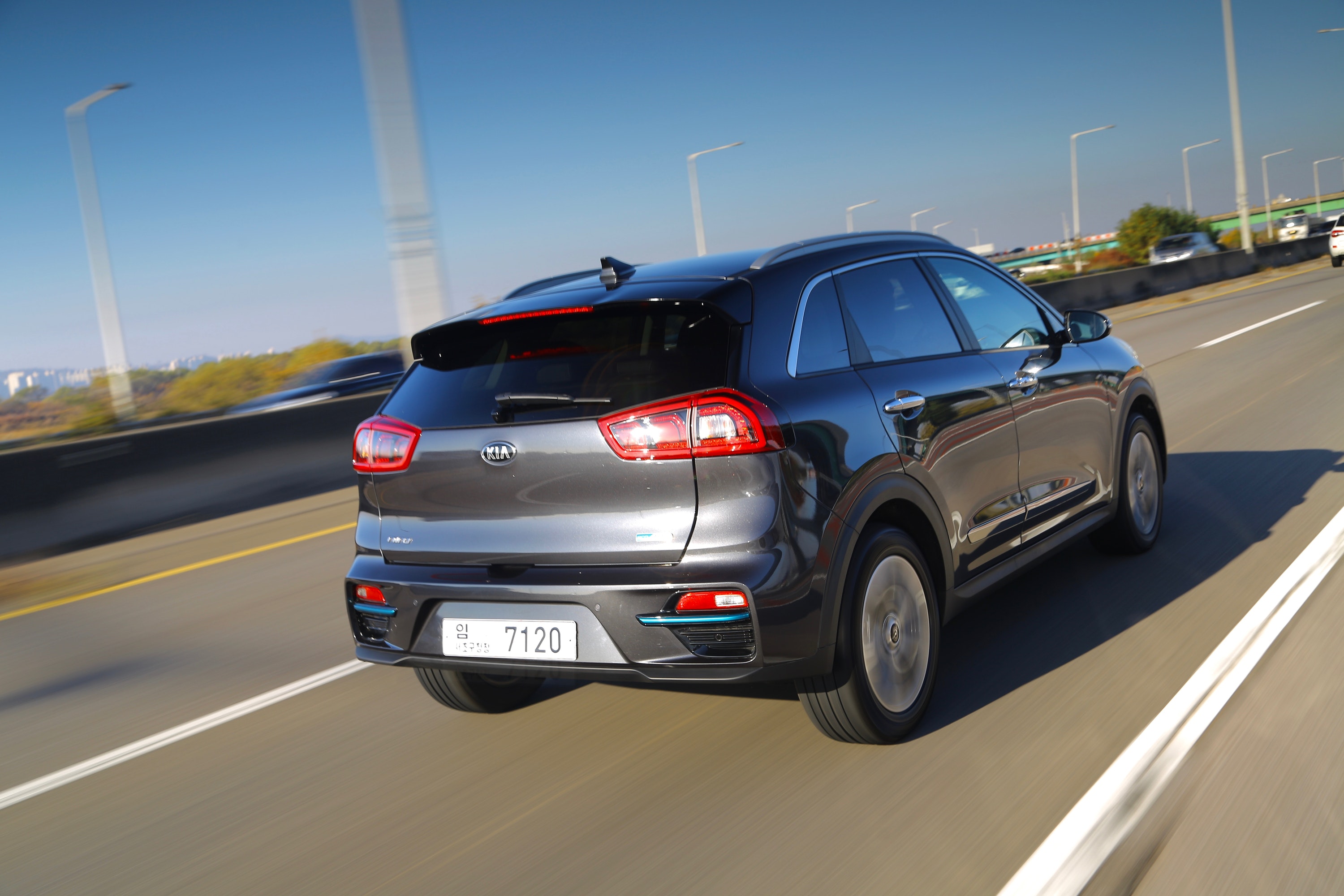 Rear view of Kia e-Niro driving on a road